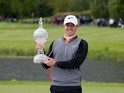 Rory McIlroy poses with the trophy after his three-shot victory in the Irish Open on May 22, 2016