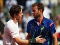 Andy Murray consoles the defeated Mathias Bourgue on day four of the French Open at Roland Garros on May 25, 2016