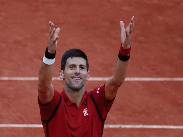 Novak Djokovic celebrates advancing to the fourth round of the French Open on May 28, 2016