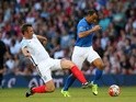 Cafu of Rest of the World beats Jonathan Wilkes of England during the Soccer Aid 2016 match in aid of UNICEF at Old Trafford on June 5, 2016