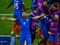 Olivier Giroud (1st L) of France celebrates scoring his team's first goal with his team mates during the UEFA Euro 2016 Group A match between France and Romania at Stade de France on June 10, 2016 in Paris, France