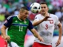 Northern Ireland's Conor Washington vies with Poland's Artur Jedrzejczyk during the Euro 2016 Group C match on June 12, 2016