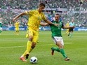Yavhen Khacheridi and Conor Washington in action during the Euro 2016 Group C match between Ukraine and Northern Ireland on July 16, 2016