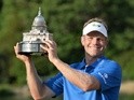 Billy Hurley III holds up the trophy after the final round of the Quicken Loans National at Congressional Country Club in Bethesda, Maryland on June 26, 2016