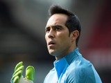 Manchester City goalkeeper Claudio Bravo warms up ahead of his debut against Manchester United at Old Trafford on September 10, 2016