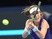 Johanna Konta of Britain hits a return to Agnieszka Radwanska of Poland at the China Open on October 9, 2016
