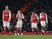 An assortment of Arsenal players react at the end of their Champions League game against PSG on November 23, 2016