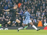 Kelechi Iheanacho scores with Jozo Simunovic in pursuit during the Champions League game between Manchester City and Celtic on December 6, 2016