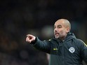 Manchester City manager Pep Guardiola watches on during his side's Premier League clash with Hull City at the Etihad Stadium on Boxing Day