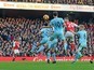 Shkodran Mustafi heads in the opener during the Premier League game between Arsenal and Burnley on January 22, 2017