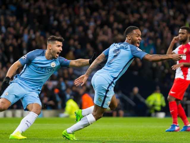 Manchester City winger Raheem Sterling wheels away in celebration after opening the scoring in the Champions League last 16 first leg against AS Monaco at the Etihad Stadium on February 21, 2017
