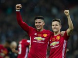 Manchester United duo Marcos Rojo and Ander Herrera celebrate after their EFL Cup final win over Southampton at Wembley on February 26, 2017