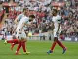 Jermain Defoe celebrates scoring with Eric Dier and Adam Lallana during the World Cup qualifier between England and Lithuania on March 26, 2017