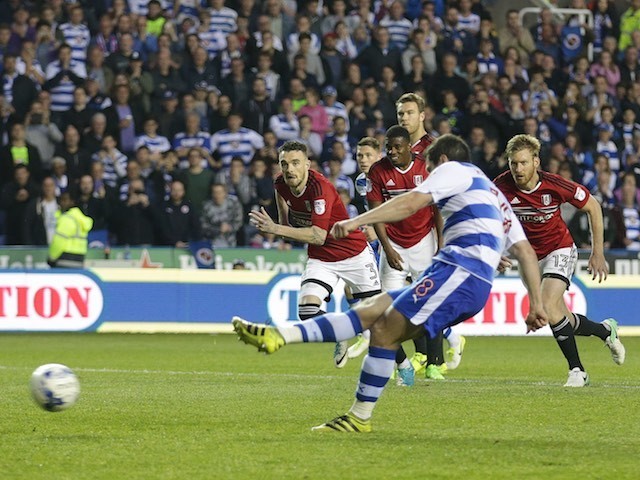 Yann Kermorgant scores from the spot during the Championship playoff semi-final game between Reading and Fulham on May 16, 2017