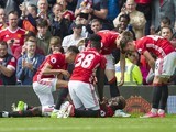 Paul Pogba celebrates with teammates after scoring during the Premier League game between Manchester United and Crystal Palace on May 21, 2017