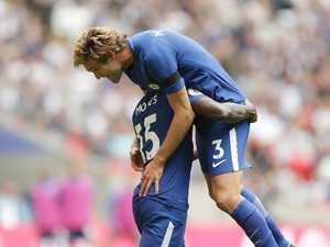 Marcos Alonso celebrates the opening goal during the Premier League game between Tottenham Hotspur and Chelsea on August 20, 2017