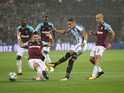 Tom Ince has a shot blocked during the Premier League game between West Ham United and Huddersfield Town on September 11, 2017