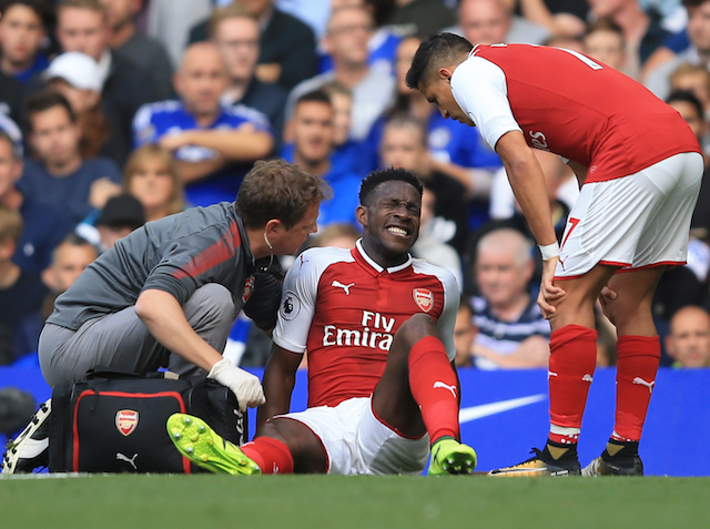 Danny Welbeck sits injured during the Premier League game between Chelsea and Arsenal on September 17, 2017