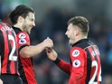 Bournemouth midfielder Ryan Fraser celebrates with teammate Harry Arter after scoring during his side's Premier League clash with Swansea City at the Liberty Stadium on December 31, 2016